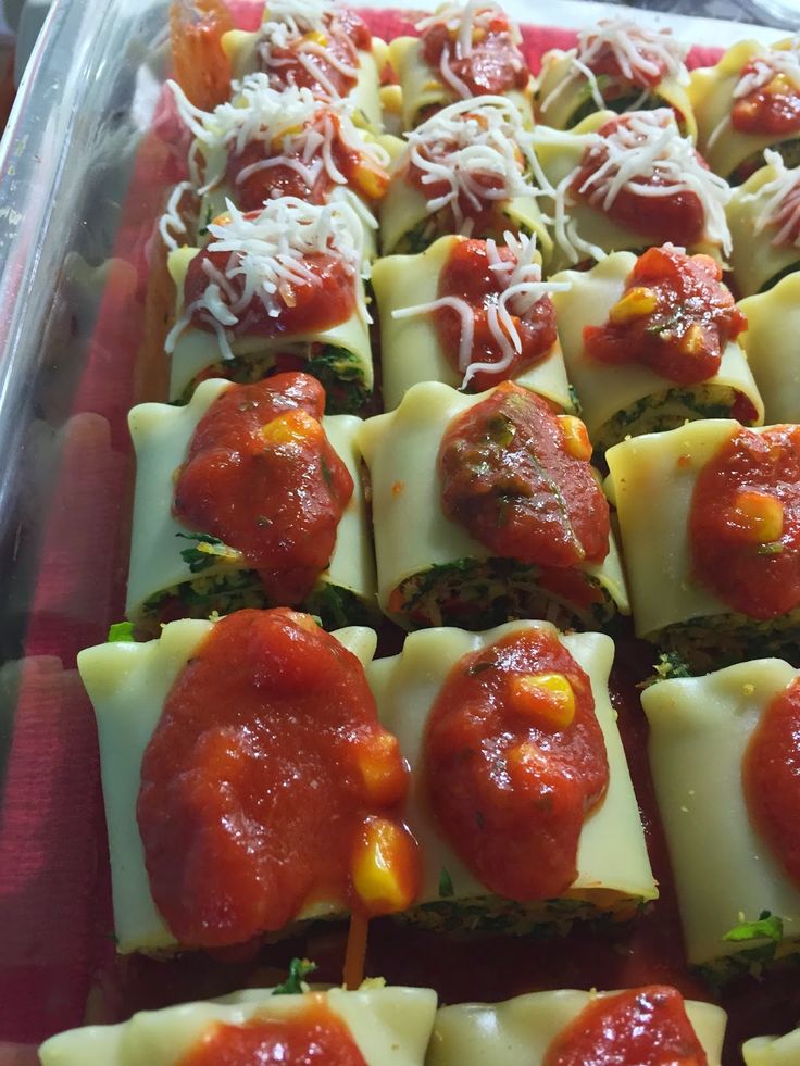 a tray filled with lots of different types of appetizers on top of each other