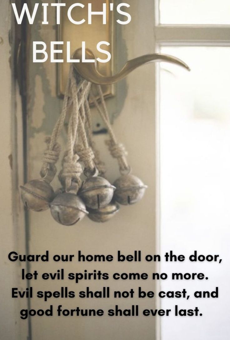 a door with bells hanging from it's side and the words witch's bells