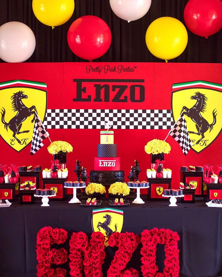 a ferrari themed birthday party with red, yellow and black decorations