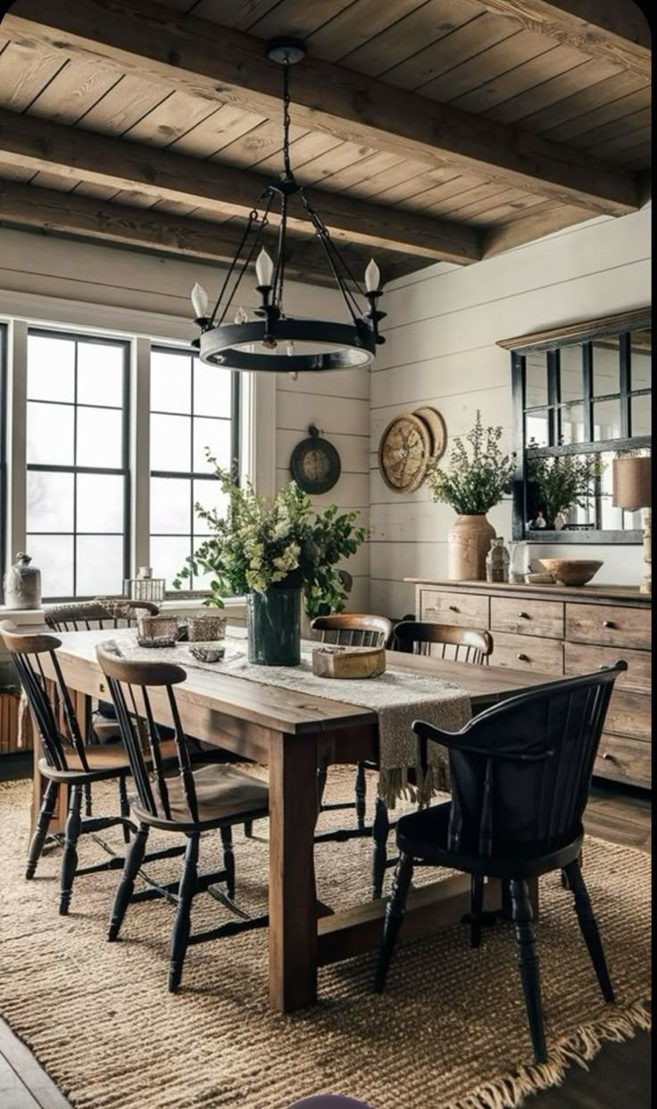 the dining room table is surrounded by chairs