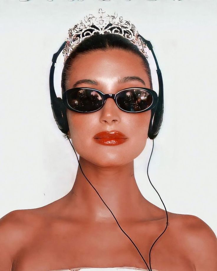 a woman wearing sunglasses and headphones on her face