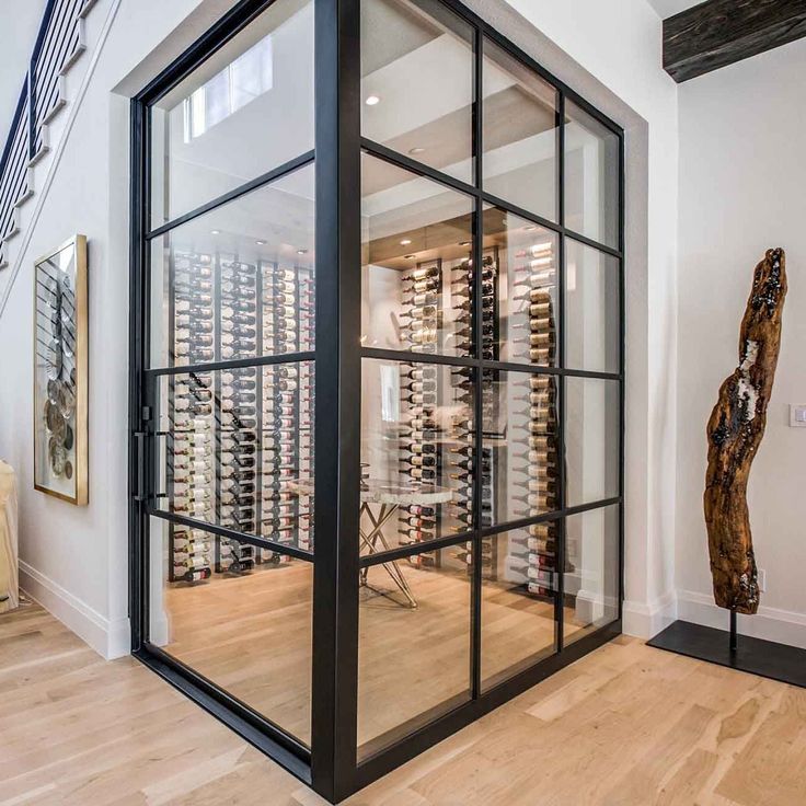 modern-wine-cellar-steel-french-door-with-large-clear-glass-wall Full Glass Wall, Wrought Iron Entry Doors, Cellar Doors, Glass Wine Cellar, Steel French Doors, Wine Cellar Door, Wine Closet, Iron Entry Doors, Home Wine Cellars