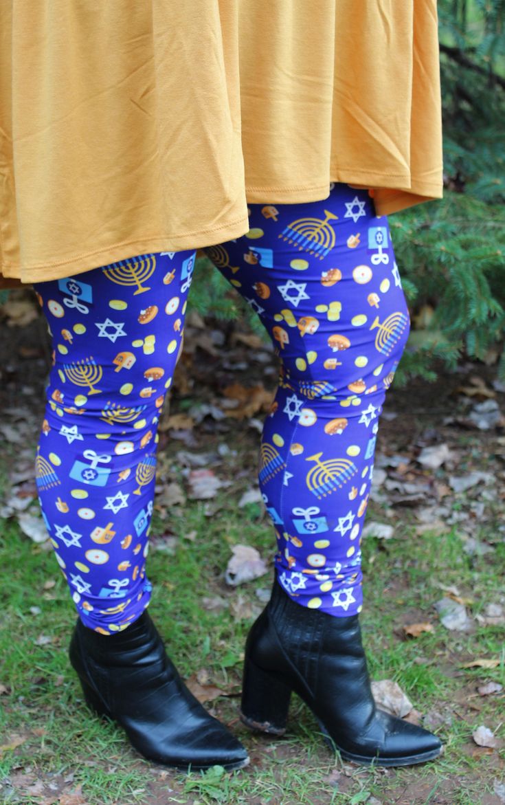 the legs and leggings of a woman in yellow shirt and blue patterned pants