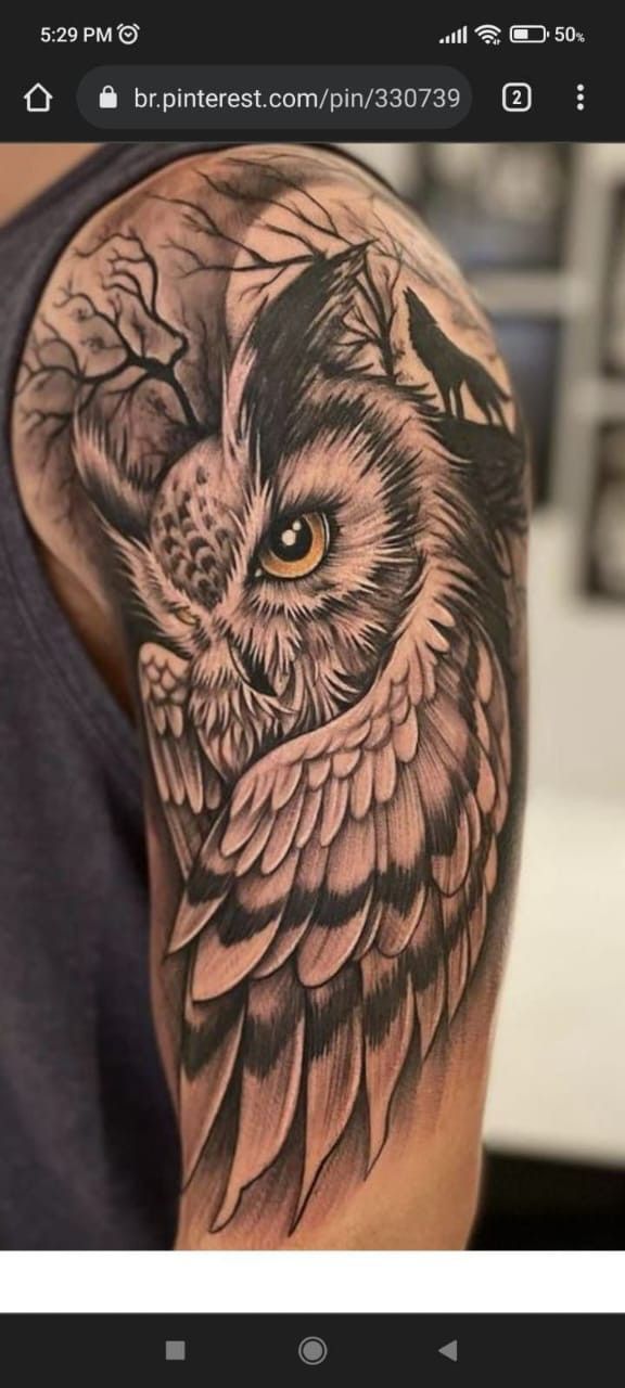 an owl tattoo is shown on the arm