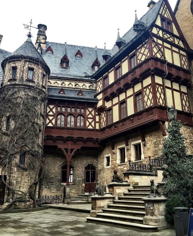 an old building with stairs leading up to it