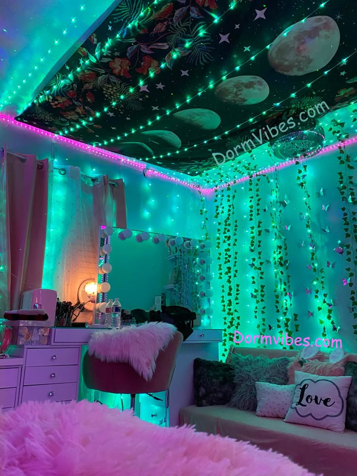 a room decorated in pink, green and purple with lights on the ceiling above it