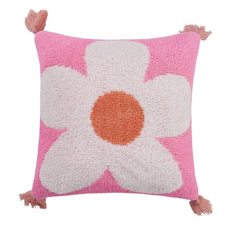 a pink and white pillow with a flower on it