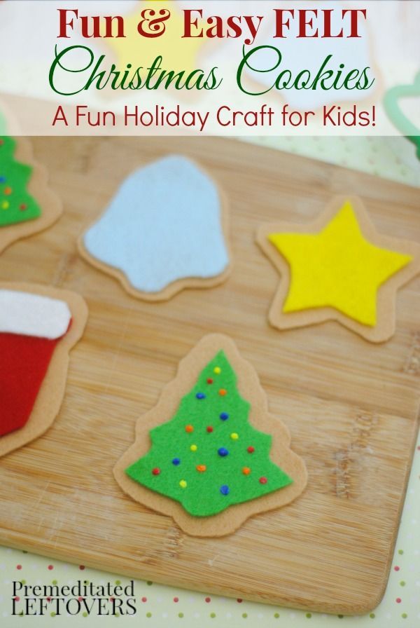 easy kid's craft felt christmas cookies on a cutting board with stars and trees