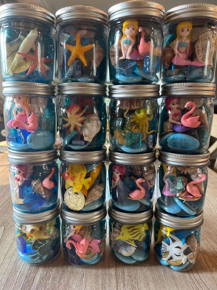 a stack of glass jars filled with toys