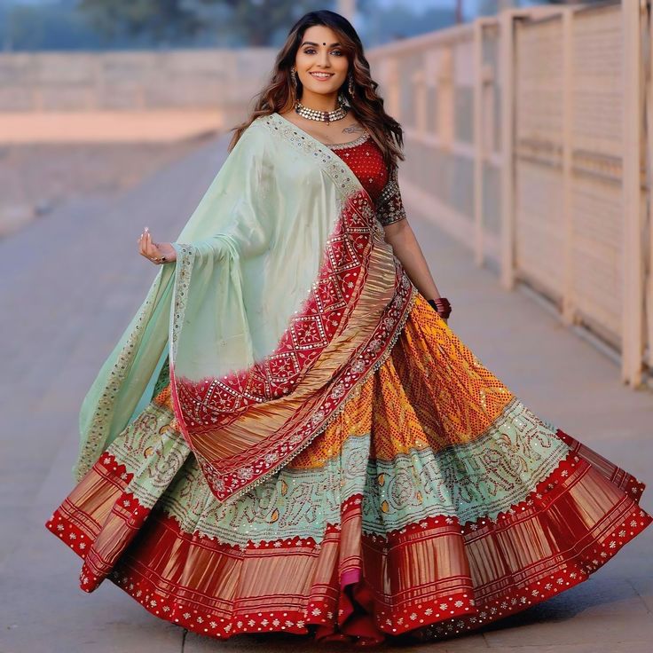 Prachi Solanki Orange Colour Chaniya Choli For Navratri Lehenga Fabric: Heavy Butter Silk with Digital Print Flair: 4 meters Work: Real Mirror Work Type: Fully Stitched Inner: Silk Length: 44 inches Blouse Fabric: Soft Butter Silk Work: Real Mirror Work Type: Unstitched (1.20 meters) Dupatta Fabric: Heavy Butter Silk Work: Real Mirror Work and Handwork Lace Border Package Contains: Lehenga, Blouse (Unstitched), and Dupatta Weight: 1 kg Gujarati Garba, Orang India, Garba Outfit, Chaniya Choli Designs, डिजाइनर कपड़े, Garba Dress, Navratri Dress, Indian Outfits Lehenga, Navratri Chaniya Choli