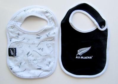 two baby bibs with black and white designs on them