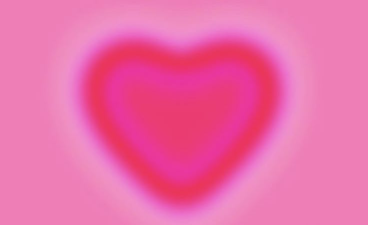 a pink heart shaped object on a pink background