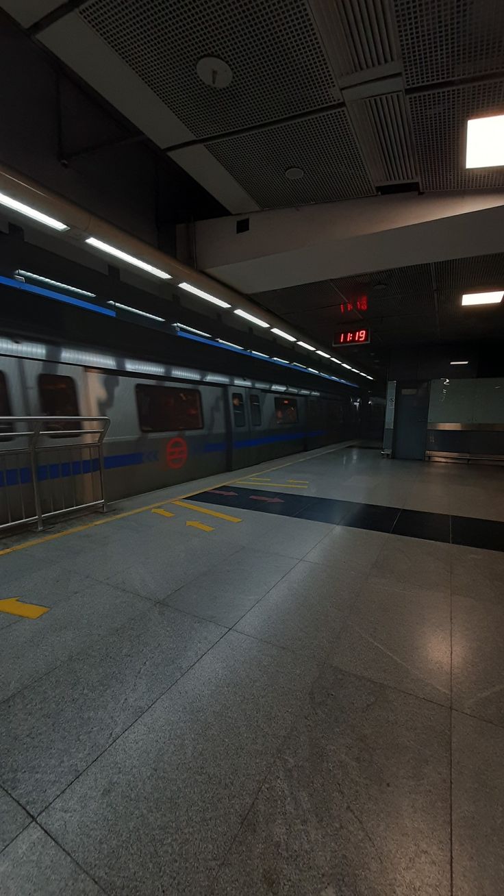 an empty subway station with no people on the platform