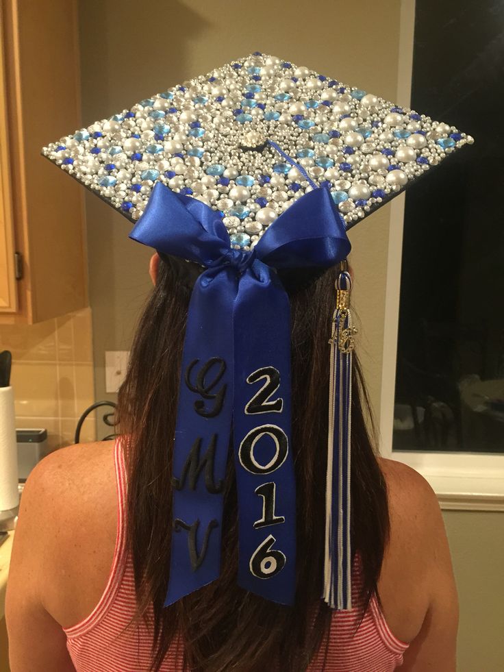 a woman wearing a graduation cap decorated with beads