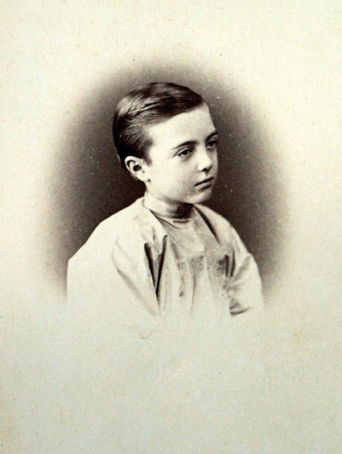 an old black and white photo of a young boy