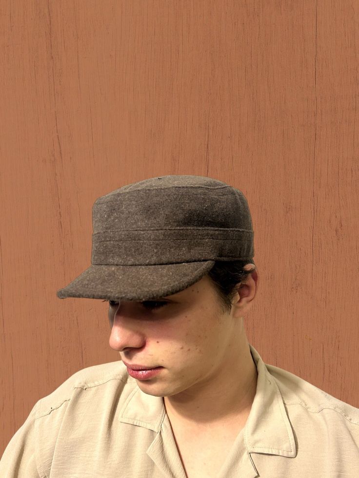 Elevate your winter outdoor style with our Brown Winter Cadet Cap, a versatile and adjustable hat inspired by military and duty ranger aesthetics. Crafted with care, this unisex brown cap seamlessly combines fashion with functionality, making it the ideal accessory for hiking, hunting, and outdoor adventures. Discover The Versatility Of Our Hat: -Classic fidel castro hat design with a modern twist -Wool construction for warmth and durability -Adjustable sun hat suitable for various head sizes -Military-style hat with a duty ranger vibe -Perfect brown soldier cap for winter expeditions -Camper hat for outdoor enthusiasts -Versatile and stylish winter hat for men and women Discover the rugged charm of our duty ranger hat, designed for those who appreciate military-inspired fashion. The deep Winter Outdoor Hats With Short Brim, Brown Wool Visor Hat, Winter Outdoor Baseball Cap, Outdoor Brown Winter Hats, Military Style Brown Hat With Curved Brim, Brown Military Hat With Curved Brim, Outdoor Flat Cap, Brown Hunting Cap, Wool Adjustable Baseball Cap For Outdoor