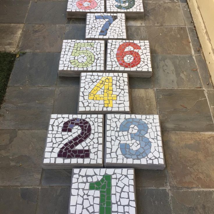 the numbers are laid out on the sidewalk to make them look like they have been painted