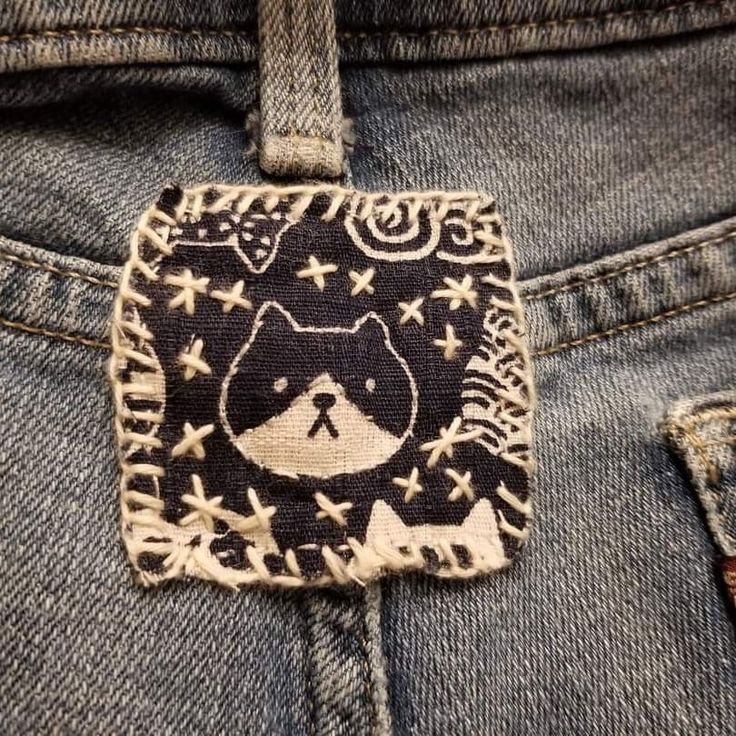 a close up of a person's jeans with a patch on it