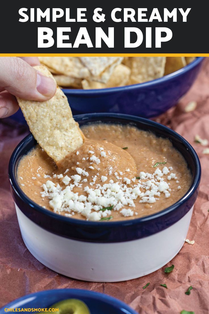 a hand dipping a tortilla chip into a bowl of bean dip with text overlay