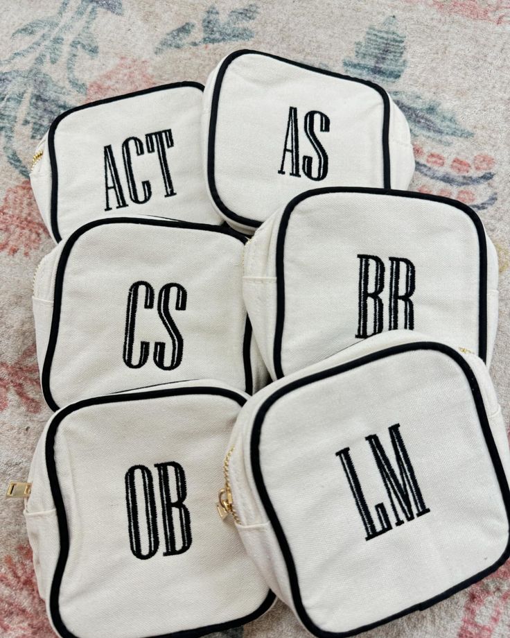 four bags with the words act as, bcs, and lm printed on them