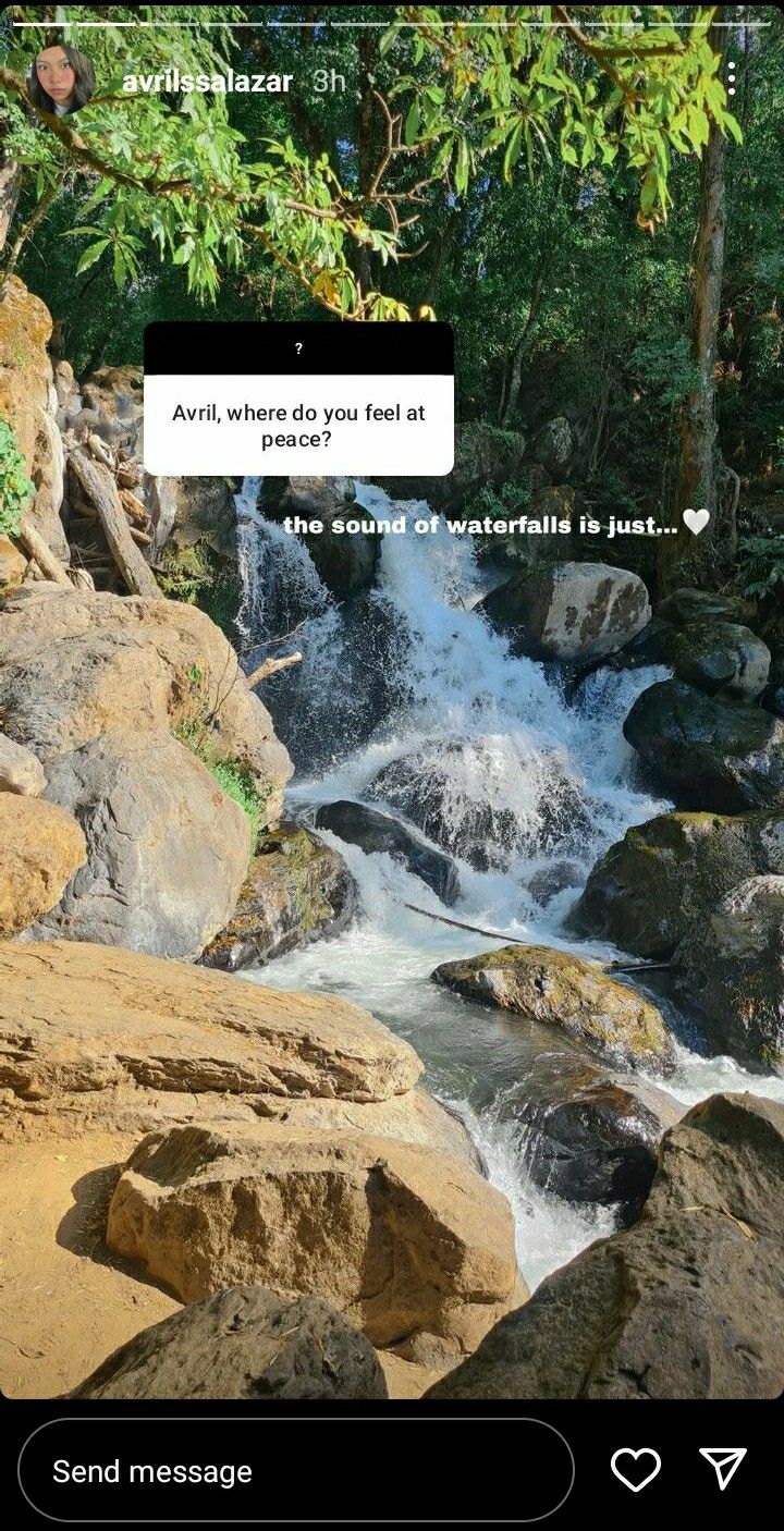 an image of a river with rocks in the foreground and texting above it