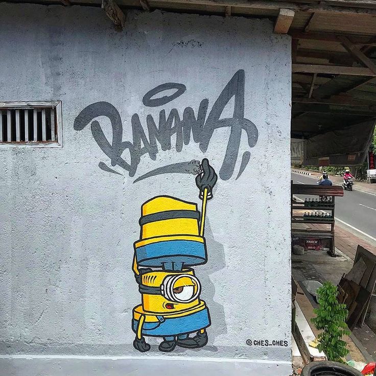 graffiti on the side of a building depicting a cartoon character