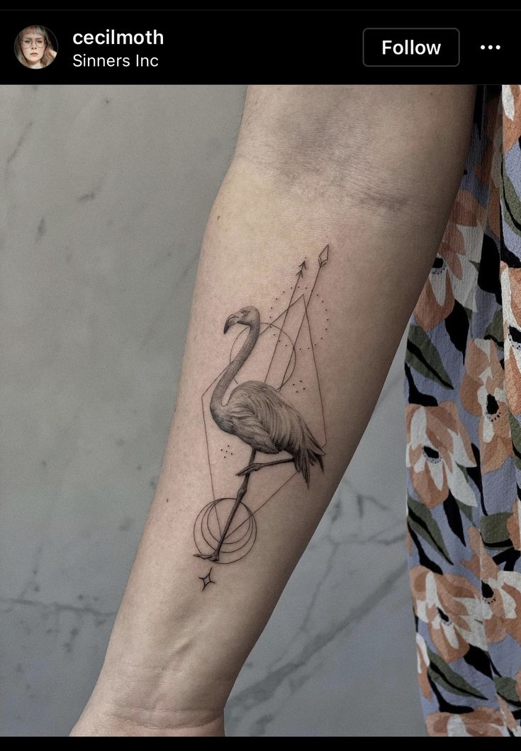 a flamingo tattoo on the left inner arm and leg, with an arrow in the middle