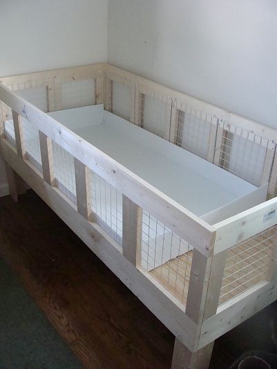 the baby crib is made out of wood