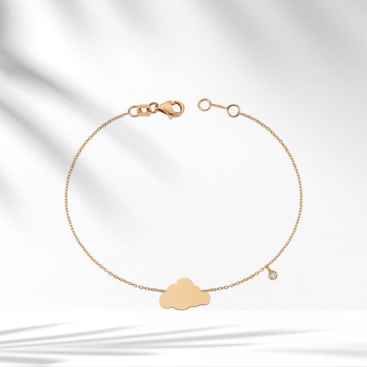 ☁︎8k/14k/18k Solid Gold Cloud Charm Bracelet with Dangle Diamond, Minimalist Gold Cloud Bracelet, Bazel Setting Dainty Valentines Day gift☁︎      Description: ☁️Embrace the delicate beauty of our 8k/14k/18k Solid Gold Cloud Diamond Bracelet. A tiny, dainty masterpiece that adds a touch of enchantment to your style.☁️ 💎 Featuring a certified diamond, our Cloud Bracelet is a symbol of elegance and grace. 💎 Details of the Product: Weight: Approximately 1.55g Diamonds: 0.02ct Color: F Clarity: SI Piece: 1 Cut: Round ☁️ Never lose hope. The darkest clouds procede the loveliest rain.-Avijeet Das. ☁️ Our Cloud Bracelet is more than jewelry; it's a fashionable statement that enhances your look with a touch of charm. Every piece is handmade with precision, crafted from genuine 8K, 14K, or 18K rea Cloud Jewelry, Cloud Bracelet, Gold Armband, Delicate Beauty, Fancy Jewelry, Selling Jewelry, Real Gold, Diamond Bracelet, Valentine Day Gifts