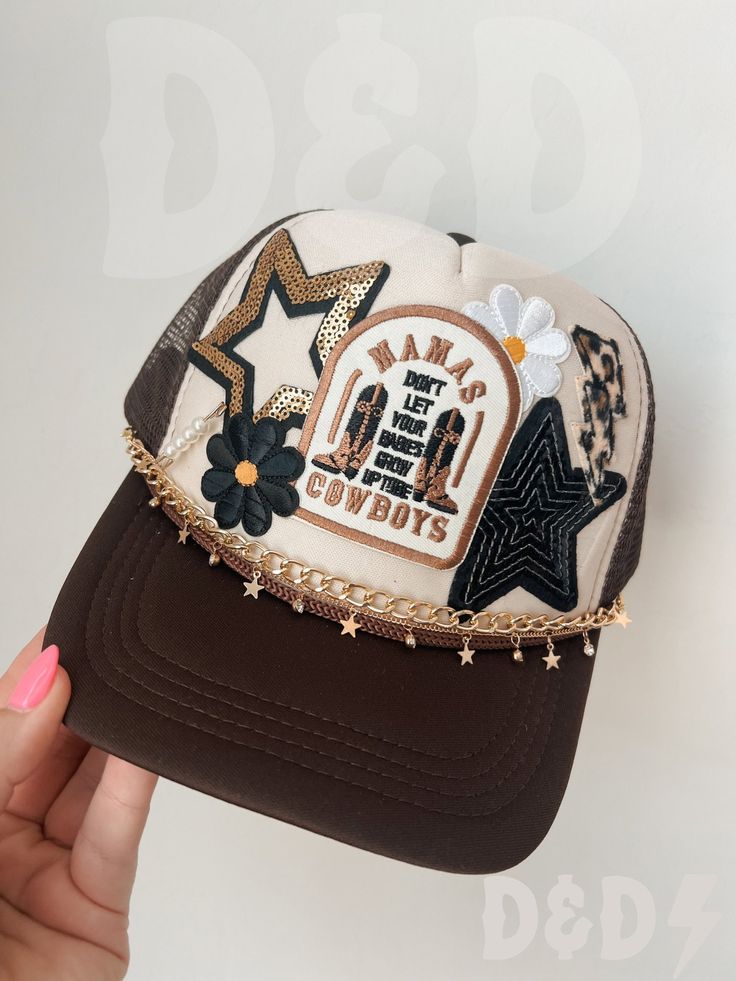 This custom made trucker patch hat is perfect for any occasion whether it be for spring/summer time, a lake hat, a gift for someone, or just a cute accessory to add a little spice to your outfit 🧢✨ DETAILS-  * This hat is one size with an adjustable SnapBack that is adjustable from 20in. - 23.5in. * The color of this hat is Tan & Brown * The material of the hat is polyester with iron on patches  NOTICE OF NON-AFFILIATION AND DISCLAIMER: We are not affiliated, associated, authorized, endorsed by, or in any way officially connected with the brand shown or any of its subsidiaries or its affiliates. All related names, marks, emblems and images are registered trademarks of their respective owners. These are not official merchandise. REFUNDS AND CANCELLATIONS- Every hat is handmade by me as a r College Trucker Hat, Hat Patches Diy, Trendy Snapback Hat For Country Events, Spring Western Trucker Hat, Snapback Hats For Country Events In Spring, Spring Snapback Hats For Country Events, Spring Rodeo Trucker Hat, Spring Rodeo Flat Brim Trucker Hat, Patch Hats Baseball Caps