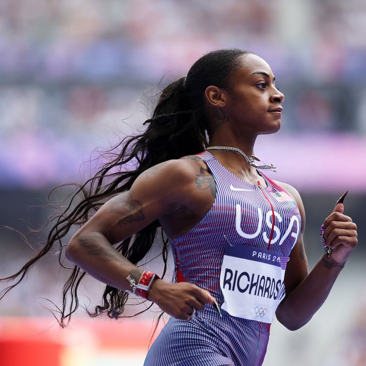 a female professional athlete running in a competition