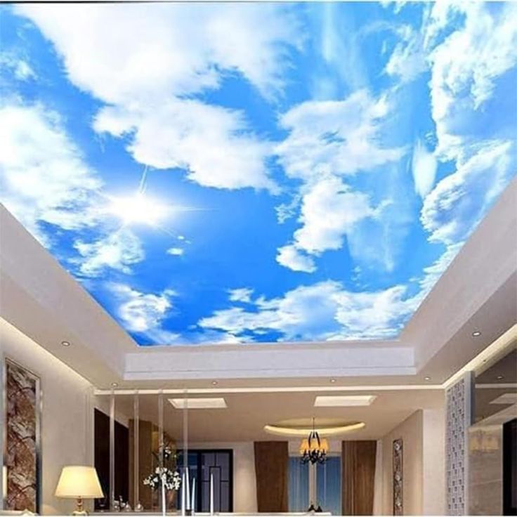 the ceiling is decorated with blue sky and white clouds in this living room, it looks like an art work