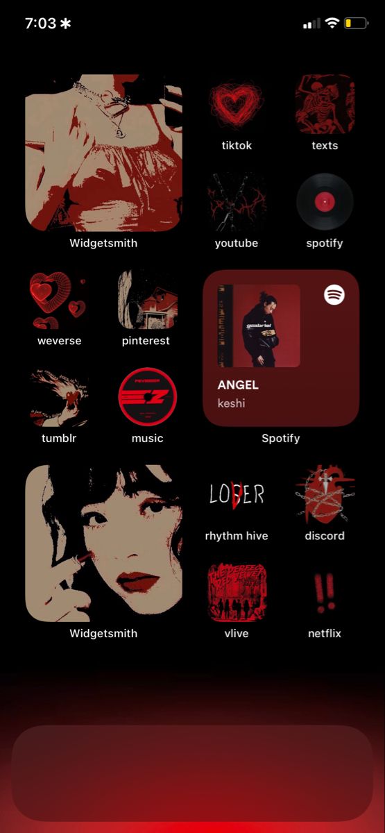 an iphone screen with the music player on it and icons displayed in red, black and white