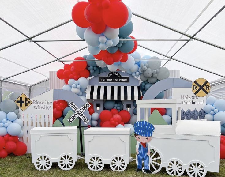 a train themed birthday party with balloons and decorations