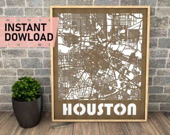 the houston map is displayed in front of a brick wall with a potted plant