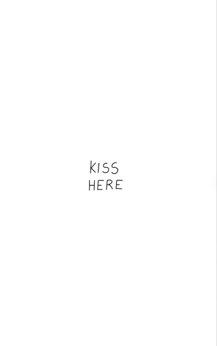 a black and white photo with the words kiss here