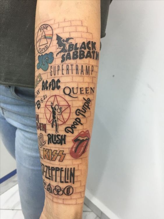 a person with a tattoo on their arm that has words and symbols all over it