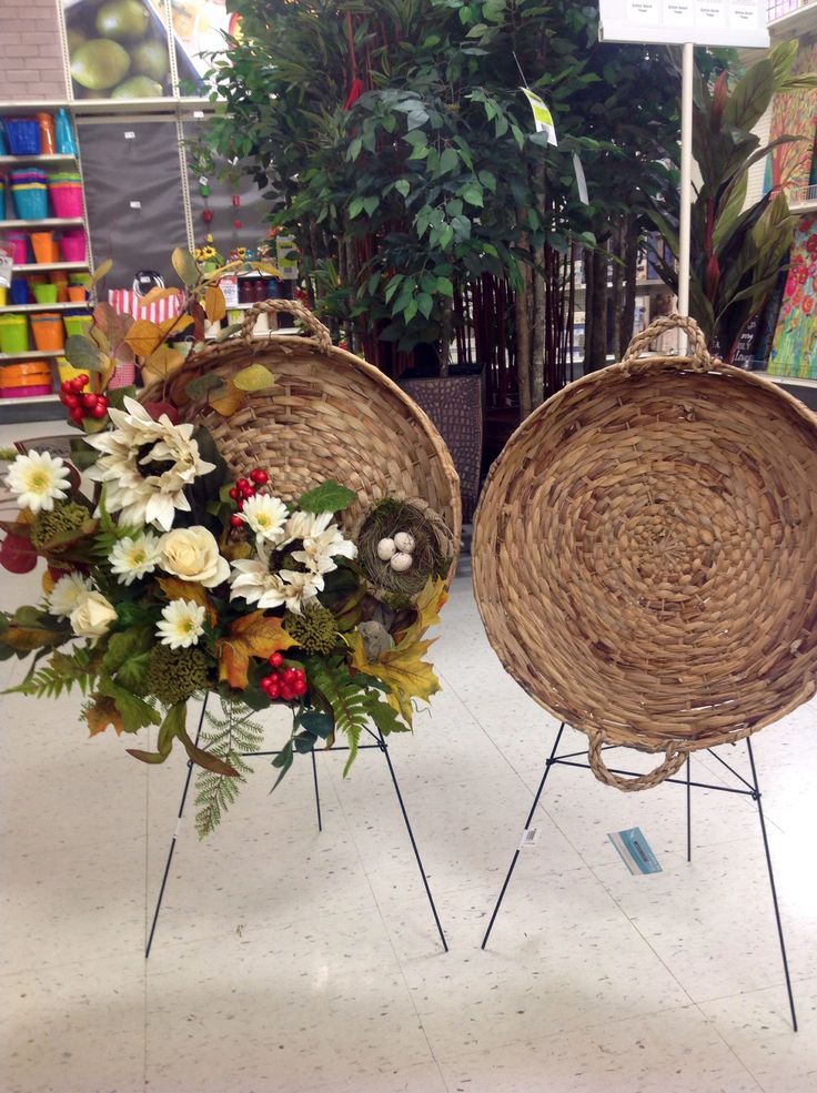 two wicker baskets with flowers are on display