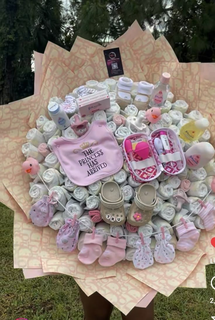 a person holding a bunch of baby items