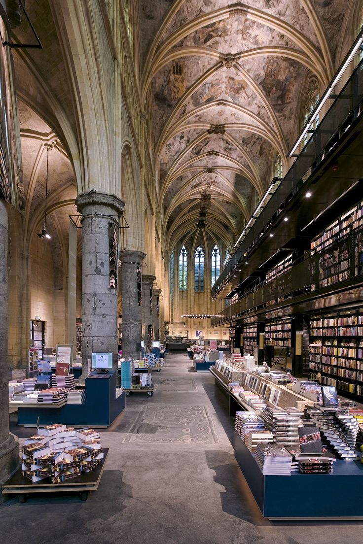 an image of the inside of a library with bookshelves on each shelf and in front of it