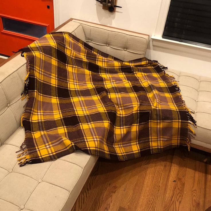 a couch with a blanket on top of it