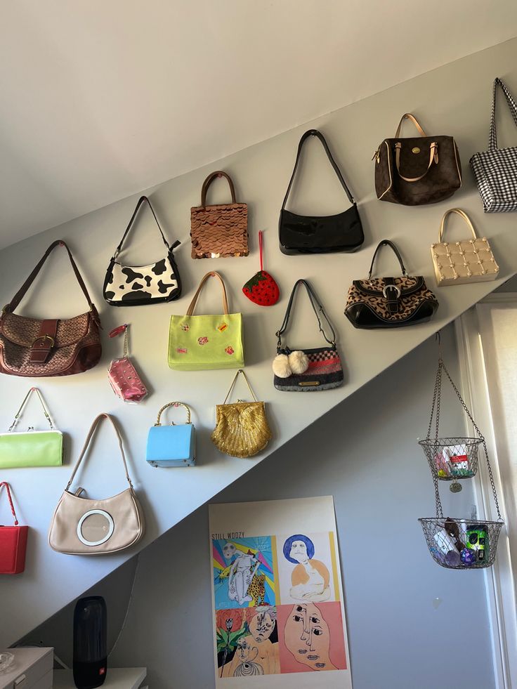 a bunch of purses are hanging on the wall