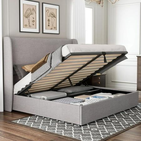 a bed with a storage compartment underneath it