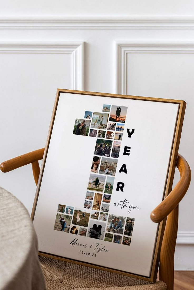 a wooden chair sitting in front of a white wall with a cross made out of photos