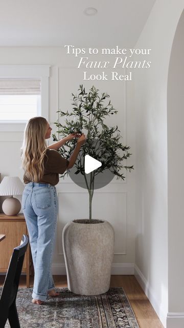 a woman standing in front of a potted plant with the words tips to make your flatter plants look real