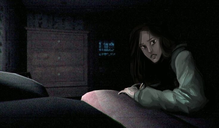 a woman sitting on top of a bed in the dark with her hand on her stomach