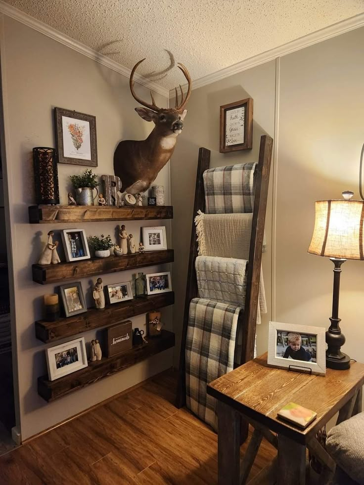 a living room filled with furniture and pictures on the wall next to a wooden table