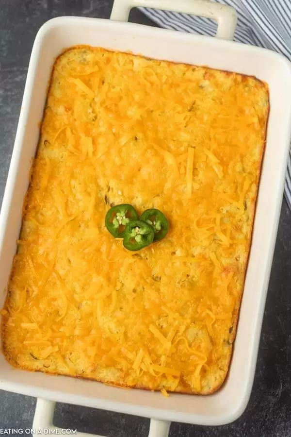 a casserole dish with cheese and green peppers in it, ready to be eaten