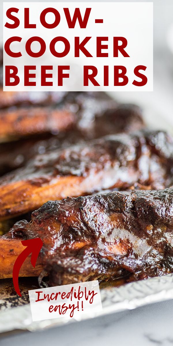 the words slow cooker beef ribs are in front of grilled meat on a plate