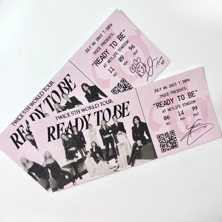 two pink tickets with the words ready to be written on them, sitting next to each other